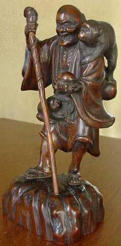 Ancienne statue japonnaise - l'Homme aux singes